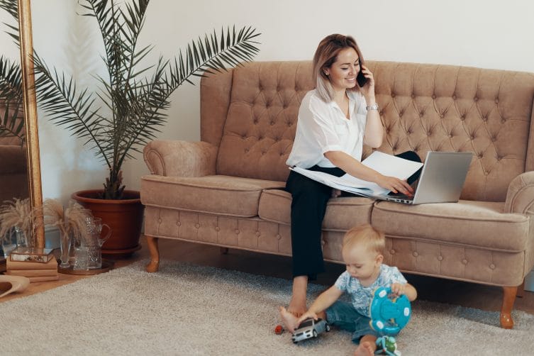 beautiful business woman working home multi tasking freelance motherhood concept